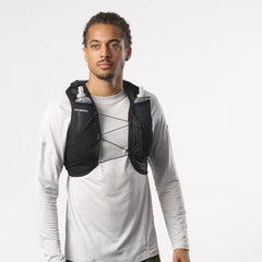 Person wearing a Salomon hydration vest on a plain background