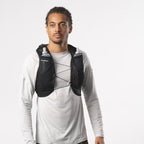 Person wearing a Salomon hydration vest on a plain background